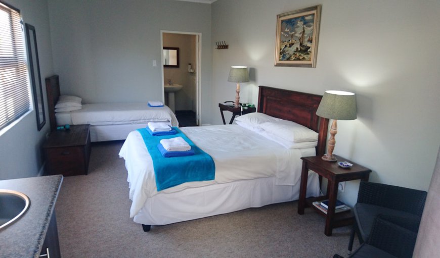 Room 5: Room 5 - This bedroom is furnished with a double bed and a single bed